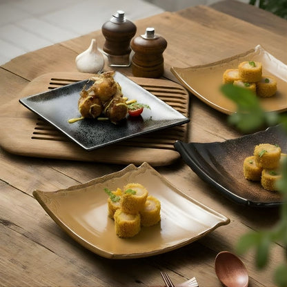 Plated dishes of food on a wooden table with a wooden spoon and fork.